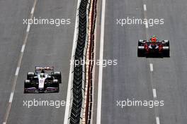 Mick Schumacher (GER) Haas VF-21 and Sergio Perez (MEX) Red Bull Racing RB16B. 05.06.2021. Formula 1 World Championship, Rd 6, Azerbaijan Grand Prix, Baku Street Circuit, Azerbaijan, Qualifying Day.