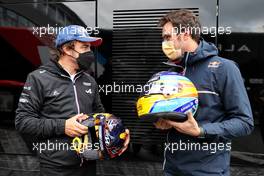 (L to R): Fernando Alonso (ESP) Alpine F1 Team swaps helmets with Thierry Neuville (BEL) WRC Rally Driver. 27.08.2021. Formula 1 World Championship, Rd 12, Belgian Grand Prix, Spa Francorchamps, Belgium, Practice Day.