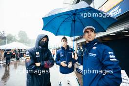 (L to R): Alexander Albon (THA) Red Bull Racing Reserve and Development Driver; George Russell (GBR) Williams Racing; and Nicholas Latifi (CDN) Williams Racing, in the pits while the race is stopped. 29.08.2021. Formula 1 World Championship, Rd 12, Belgian Grand Prix, Spa Francorchamps, Belgium, Race Day.