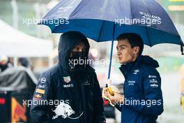 (L to R): Alexander Albon (THA) Red Bull Racing Reserve and Development Driver with George Russell (GBR) Williams Racing in the pits while the race is stopped. 29.08.2021. Formula 1 World Championship, Rd 12, Belgian Grand Prix, Spa Francorchamps, Belgium, Race Day.