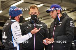 (L to R): Fernando Alonso (ESP) Alpine F1 Team with Laurent Rossi (FRA) Alpine Chief Executive Officer and Esteban Ocon (FRA) Alpine F1 Team in the pits as the race is suspended. 29.08.2021. Formula 1 World Championship, Rd 12, Belgian Grand Prix, Spa Francorchamps, Belgium, Race Day.