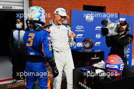 George Russell (GBR) Williams Racing celebrates his second position in qualifying parc ferme with Daniel Ricciardo (AUS) McLaren. 28.08.2021. Formula 1 World Championship, Rd 12, Belgian Grand Prix, Spa Francorchamps, Belgium, Qualifying Day.