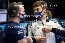 George Russell (GBR) Williams Racing with James Urwin (GBR) Williams Racing Race Engineer. 26.03.2021. Formula 1 World Championship, Rd 1, Bahrain Grand Prix, Sakhir, Bahrain, Practice Day