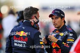 (L to R): Christian Horner (GBR) Red Bull Racing Team Principal with Sergio Perez (MEX) Red Bull Racing on the grid. 28.03.2021. Formula 1 World Championship, Rd 1, Bahrain Grand Prix, Sakhir, Bahrain, Race Day.