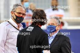 (L to R): Stefano Domenicali (ITA) Formula One President and CEO on the grid with Fernando Alonso (ESP) Alpine F1 Team and Jean Todt (FRA) FIA President. 28.03.2021. Formula 1 World Championship, Rd 1, Bahrain Grand Prix, Sakhir, Bahrain, Race Day.