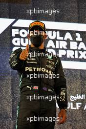 Race winner Lewis Hamilton (GBR) Mercedes AMG F1 celebrates on the podium. 28.03.2021. Formula 1 World Championship, Rd 1, Bahrain Grand Prix, Sakhir, Bahrain, Race Day.