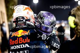 Race winner Lewis Hamilton (GBR) Mercedes AMG F1 celebrates with second placed Max Verstappen (NLD) Red Bull Racing in parc ferme. 28.03.2021. Formula 1 World Championship, Rd 1, Bahrain Grand Prix, Sakhir, Bahrain, Race Day.