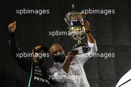 Race winner Lewis Hamilton (GBR) Mercedes AMG F1 celebrates with Russell Braithwaite (GBR) Mercedes AMG F1 Chief Financial Officer on the podium. 28.03.2021. Formula 1 World Championship, Rd 1, Bahrain Grand Prix, Sakhir, Bahrain, Race Day.