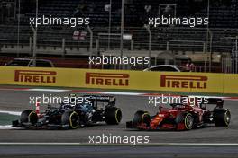 Sebastian Vettel (GER) Aston Martin F1 Team AMR21 and Charles Leclerc (MON) Ferrari SF-21 battle for position. 28.03.2021. Formula 1 World Championship, Rd 1, Bahrain Grand Prix, Sakhir, Bahrain, Race Day.