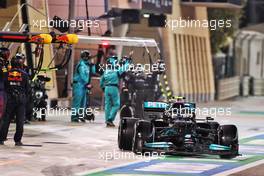 Valtteri Bottas (FIN) Mercedes AMG F1 W12 makes a pit stop. 28.03.2021. Formula 1 World Championship, Rd 1, Bahrain Grand Prix, Sakhir, Bahrain, Race Day.