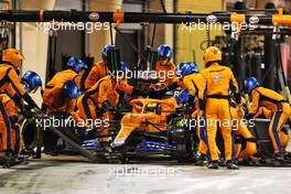 Lando Norris (GBR) McLaren MCL35M makes a pit stop. 28.03.2021. Formula 1 World Championship, Rd 1, Bahrain Grand Prix, Sakhir, Bahrain, Race Day.
