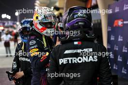 Max Verstappen (NLD) Red Bull Racing and Lewis Hamilton (GBR) Mercedes AMG F1 in qualifying parc ferme. 27.03.2021. Formula 1 World Championship, Rd 1, Bahrain Grand Prix, Sakhir, Bahrain, Qualifying Day.