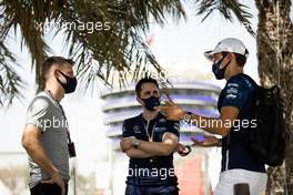 Jenson Button (GBR) Sky Sports F1 Presenter / Williams Racing Senior Advisor (Left) with George Russell (GBR) Williams Racing (Right). 27.03.2021. Formula 1 World Championship, Rd 1, Bahrain Grand Prix, Sakhir, Bahrain, Qualifying Day.