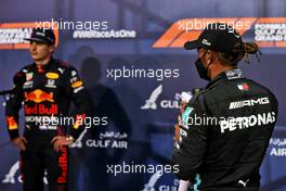 Lewis Hamilton (GBR) Mercedes AMG F1 and Max Verstappen (NLD) Red Bull Racing in qualifying parc ferme. 27.03.2021. Formula 1 World Championship, Rd 1, Bahrain Grand Prix, Sakhir, Bahrain, Qualifying Day.