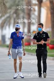 Esteban Ocon (FRA) Alpine F1 Team with James Lloyd (GBR) Alpine F1 Team Press Officer. 25.03.2021. Formula 1 World Championship, Rd 1, Bahrain Grand Prix, Sakhir, Bahrain, Preparation Day.