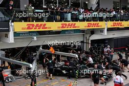 Lewis Hamilton (GBR) Mercedes AMG F1 W12 and Valtteri Bottas (FIN) Mercedes AMG F1 W12 in the pits. 12.11.2021. Formula 1 World Championship, Rd 19, Brazilian Grand Prix, Sao Paulo, Brazil, Qualifying Day.