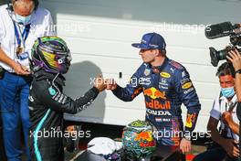 (L to R): Race winner Lewis Hamilton (GBR) Mercedes AMG F1 celebrates with second placed Max Verstappen (NLD) Red Bull Racing in parc ferme. 14.11.2021. Formula 1 World Championship, Rd 19, Brazilian Grand Prix, Sao Paulo, Brazil, Race Day.