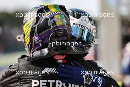 Race winner Lewis Hamilton (GBR) Mercedes AMG F1 celebrates with team mate Valtteri Bottas (FIN) Mercedes AMG F1 in parc ferme. 14.11.2021. Formula 1 World Championship, Rd 19, Brazilian Grand Prix, Sao Paulo, Brazil, Race Day.