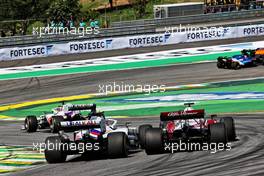 Mick Schumacher (GER) Haas VF-21 and Kimi Raikkonen (FIN) Alfa Romeo Racing C41 make contact. 14.11.2021. Formula 1 World Championship, Rd 19, Brazilian Grand Prix, Sao Paulo, Brazil, Race Day.