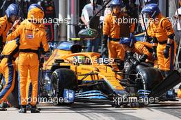 Lando Norris (GBR) McLaren MCL35M makes a pit stop. 14.11.2021. Formula 1 World Championship, Rd 19, Brazilian Grand Prix, Sao Paulo, Brazil, Race Day.