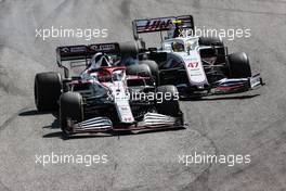 Kimi Raikkonen (FIN) Alfa Romeo Racing C41 and Mick Schumacher (GER) Haas VF-21 make contact. 14.11.2021. Formula 1 World Championship, Rd 19, Brazilian Grand Prix, Sao Paulo, Brazil, Race Day.