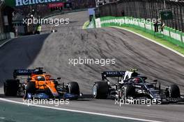 Pierre Gasly (FRA) AlphaTauri AT02 and Daniel Ricciardo (AUS) McLaren MCL35M battle for position. 14.11.2021. Formula 1 World Championship, Rd 19, Brazilian Grand Prix, Sao Paulo, Brazil, Race Day.