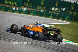 Lando Norris (GBR) McLaren MCL35M with a puncture at the start of the race. 14.11.2021. Formula 1 World Championship, Rd 19, Brazilian Grand Prix, Sao Paulo, Brazil, Race Day.