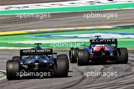 Lance Stroll (CDN) Aston Martin F1 Team AMR21 and Fernando Alonso (ESP) Alpine F1 Team A521 battle for position. 14.11.2021. Formula 1 World Championship, Rd 19, Brazilian Grand Prix, Sao Paulo, Brazil, Race Day.