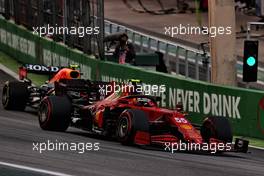 Carlos Sainz Jr (ESP) Ferrari SF-21 and Sergio Perez (MEX) Red Bull Racing RB16B battle for position. 13.11.2021. Formula 1 World Championship, Rd 19, Brazilian Grand Prix, Sao Paulo, Brazil, Sprint Race Day.