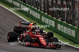 Carlos Sainz Jr (ESP) Ferrari SF-21 and Sergio Perez (MEX) Red Bull Racing RB16B battle for position. 13.11.2021. Formula 1 World Championship, Rd 19, Brazilian Grand Prix, Sao Paulo, Brazil, Sprint Race Day.
