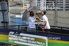 (L to R): Lewis Hamilton (GBR) Mercedes AMG F1 and Daniel Ricciardo (AUS) McLaren on the drivers parade. 14.11.2021. Formula 1 World Championship, Rd 19, Brazilian Grand Prix, Sao Paulo, Brazil, Race Day.