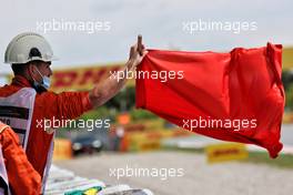 Circuit atmosphere - a marshal waves a red flag in the first practice session. 07.05.2021 Formula 1 World Championship, Rd 4, Spanish Grand Prix, Barcelona, Spain, Practice Day.