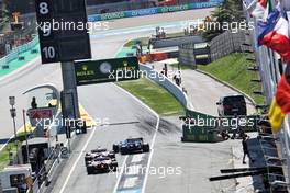 Nicholas Latifi (CDN) Williams Racing FW43B, Mick Schumacher (GER) Haas VF-21, and Nikita Mazepin (RUS) Haas F1 Team VF-21 leave the pits. 08.05.2021. Formula 1 World Championship, Rd 4, Spanish Grand Prix, Barcelona, Spain, Qualifying Day.