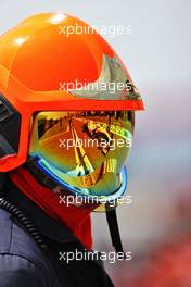 Nikita Mazepin (RUS) Haas F1 Team VF-21 reflected in a fire marshal's helmet visor. 18.06.2021. Formula 1 World Championship, Rd 7, French Grand Prix, Paul Ricard, France, Practice Day.