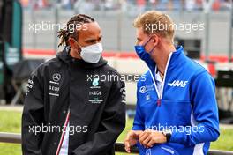(L to R): Lewis Hamilton (GBR) Mercedes AMG F1 and Mick Schumacher (GER) Haas F1 Team on the drivers parade. 20.06.2021. Formula 1 World Championship, Rd 7, French Grand Prix, Paul Ricard, France, Race Day.
