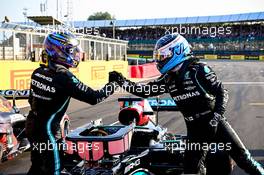 (L to R): Lewis Hamilton (GBR) Mercedes AMG F1 W12 celebrates being fastest in qualifying in parc ferme with team mate Valtteri Bottas (FIN) Mercedes AMG F1. 16.07.2021. Formula 1 World Championship, Rd 10, British Grand Prix, Silverstone, England, Practice Day.