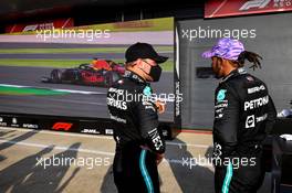 (L to R): Valtteri Bottas (FIN) Mercedes AMG F1 with team mate Lewis Hamilton (GBR) Mercedes AMG F1 in qualifying parc ferme. 16.07.2021. Formula 1 World Championship, Rd 10, British Grand Prix, Silverstone, England, Practice Day.