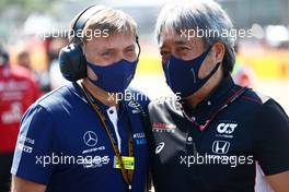 (L to R): Jost Capito (GER) Williams Racing Chief Executive Officer with Masashi Yamamoto (JPN) Honda Racing F1 Managing Director on the grid. 18.07.2021. Formula 1 World Championship, Rd 10, British Grand Prix, Silverstone, England, Race Day.