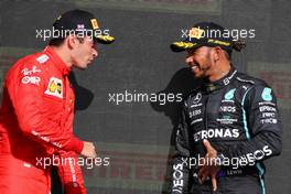 (L to R): Charles Leclerc (MON) Ferrari with race winner Lewis Hamilton (GBR) Mercedes AMG F1 on the podium. 18.07.2021. Formula 1 World Championship, Rd 10, British Grand Prix, Silverstone, England, Race Day.