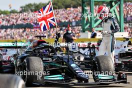 Race winner Lewis Hamilton (GBR) Mercedes AMG F1 W12 in parc ferme with George Russell (GBR) Williams Racing. 18.07.2021. Formula 1 World Championship, Rd 10, British Grand Prix, Silverstone, England, Race Day.