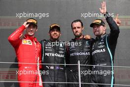 2nd place Charles Leclerc (MON) Ferrari SF-21 with 1st place Lewis Hamilton (GBR) Mercedes AMG F1 W12 and 3rd place Valtteri Bottas (FIN) Mercedes AMG F1. 18.07.2021. Formula 1 World Championship, Rd 10, British Grand Prix, Silverstone, England, Race Day.