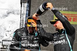 (L to R): Race winner Lewis Hamilton (GBR) Mercedes AMG F1 celebrates on the podium with third placed team mate Valtteri Bottas (FIN) Mercedes AMG F1. 18.07.2021. Formula 1 World Championship, Rd 10, British Grand Prix, Silverstone, England, Race Day.