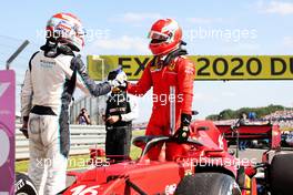(L to R): George Russell (GBR) Williams Racing with Charles Leclerc (MON) Ferrari SF-21 in parc ferme. 18.07.2021. Formula 1 World Championship, Rd 10, British Grand Prix, Silverstone, England, Race Day.