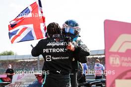 Race winner Lewis Hamilton (GBR) Mercedes AMG F1 celebrates with team mate Valtteri Bottas (FIN) Mercedes AMG F1 in parc ferme. 18.07.2021. Formula 1 World Championship, Rd 10, British Grand Prix, Silverstone, England, Race Day.