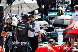 Lewis Hamilton (GBR) Mercedes AMG F1 with Peter Bonnington (GBR) Mercedes AMG F1 Race Engineer in the pits while the race is stopped. 18.07.2021. Formula 1 World Championship, Rd 10, British Grand Prix, Silverstone, England, Race Day.