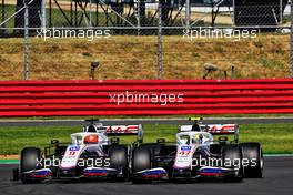 Nikita Mazepin (RUS) Haas F1 Team VF-21 and team mate Mick Schumacher (GER) Haas VF-21 battle for position. 18.07.2021. Formula 1 World Championship, Rd 10, British Grand Prix, Silverstone, England, Race Day.