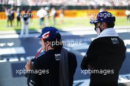 (L to R): Fernando Alonso (ESP) Alpine F1 Team and Esteban Ocon (FRA) Alpine F1 Team on the grid. 18.07.2021. Formula 1 World Championship, Rd 10, British Grand Prix, Silverstone, England, Race Day.