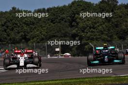 Kimi Raikkonen (FIN) Alfa Romeo Racing C41 and Valtteri Bottas (FIN) Mercedes AMG F1 W12. 17.07.2021. Formula 1 World Championship, Rd 10, British Grand Prix, Silverstone, England, Qualifying Day.