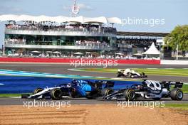 Nicholas Latifi (CDN) Williams Racing FW43B and Yuki Tsunoda (JPN) AlphaTauri AT02. 17.07.2021. Formula 1 World Championship, Rd 10, British Grand Prix, Silverstone, England, Qualifying Day.