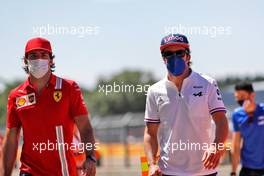 (L to R): Carlos Sainz Jr (ESP) Ferrari and Fernando Alonso (ESP) Alpine F1 Team. 18.07.2021. Formula 1 World Championship, Rd 10, British Grand Prix, Silverstone, England, Race Day.